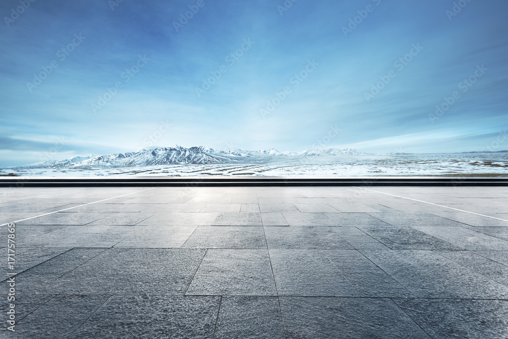 empty floor with beautiful snow mountains in blue sky