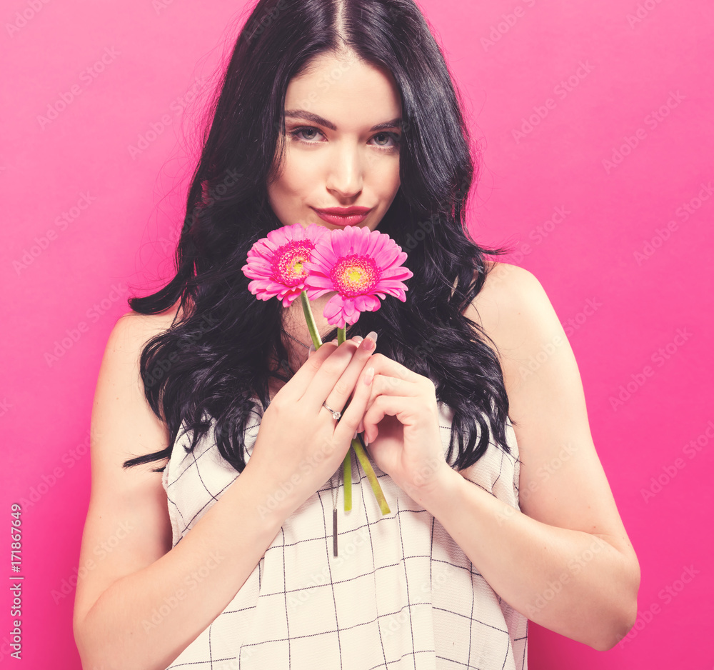 Young woman with garbela on a pink background