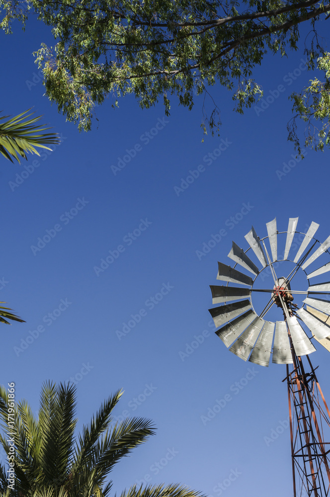 Pinwheel / Old windmill, alternative energy generation by wind energy.