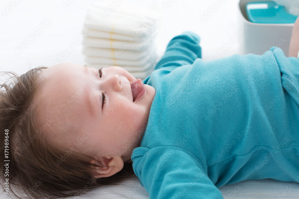 Little baby boy preparing for a diaper change