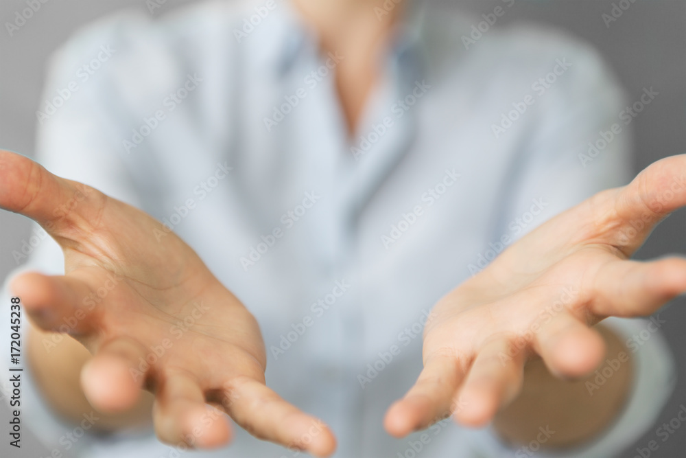 Businesswoman opening both hand