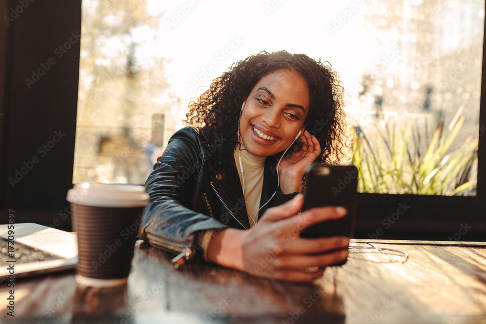 Woman video chatting on mobile phone