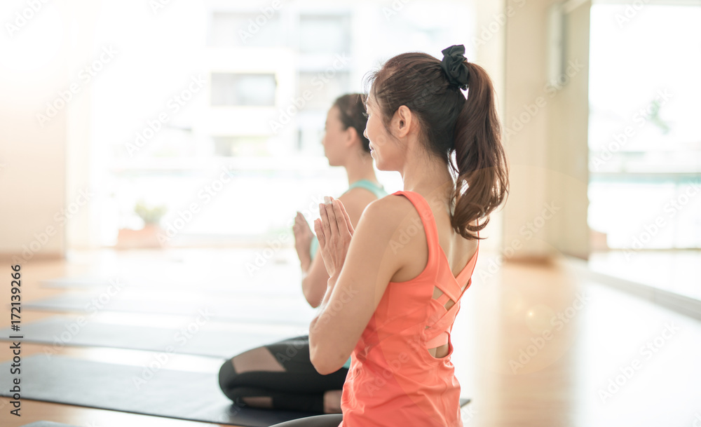 fitness, sport, training, yoga and people concept - Asian woman do exercise in gym.Group Of female D