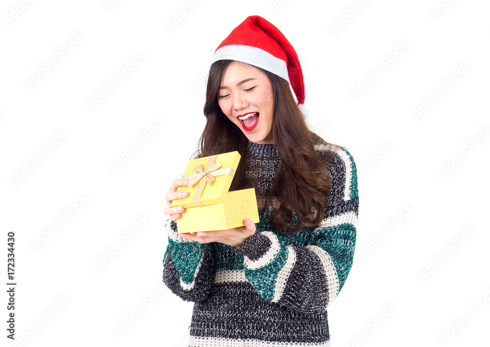 Young happy asian woman with santa hat holding gift box present for christmas party and celebration 