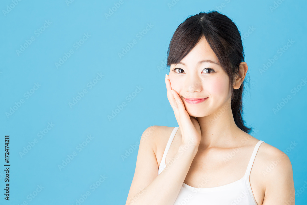 attractive asian woman beauty image isolated on blue background