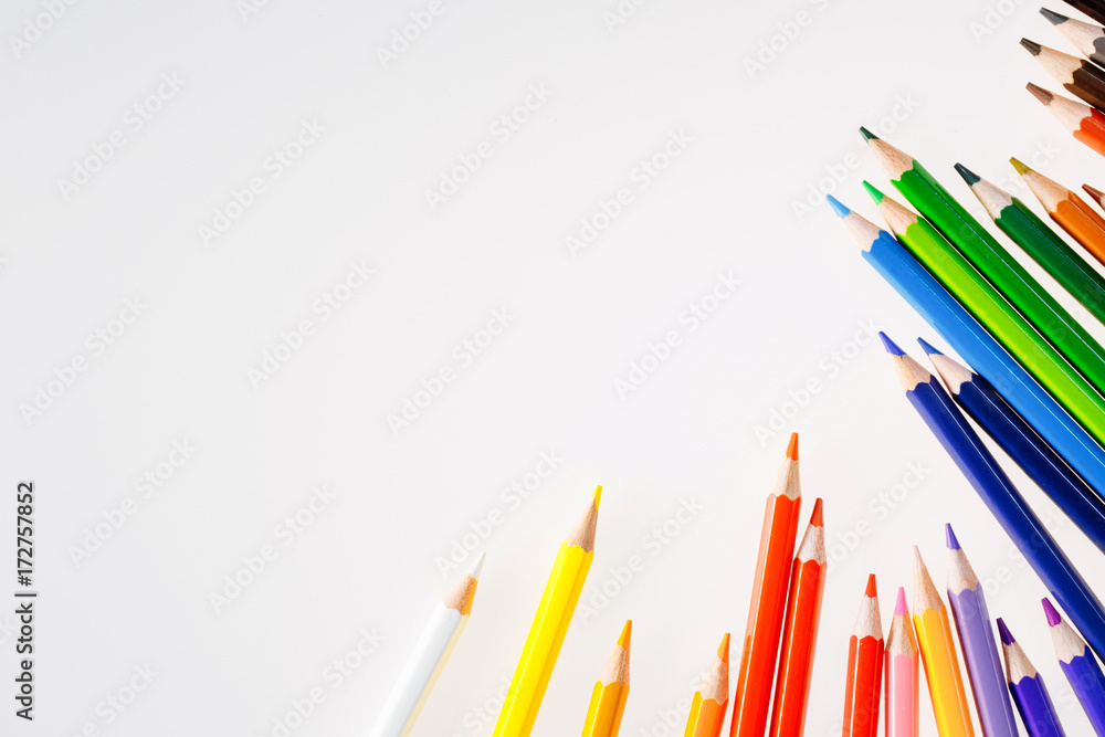 Color pencils on white background. Free space for text. Tools for drawing, education, school, creati