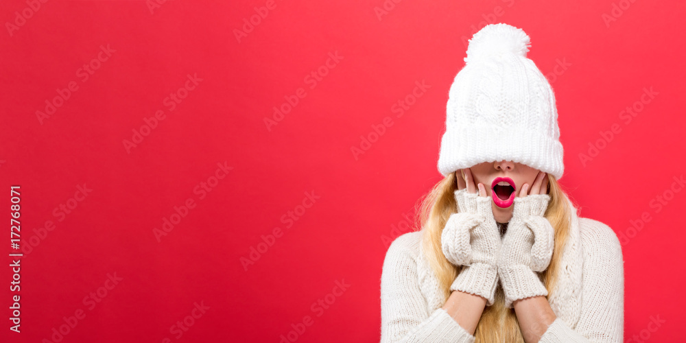 Woman with a winter knit hat pulled over her eyes