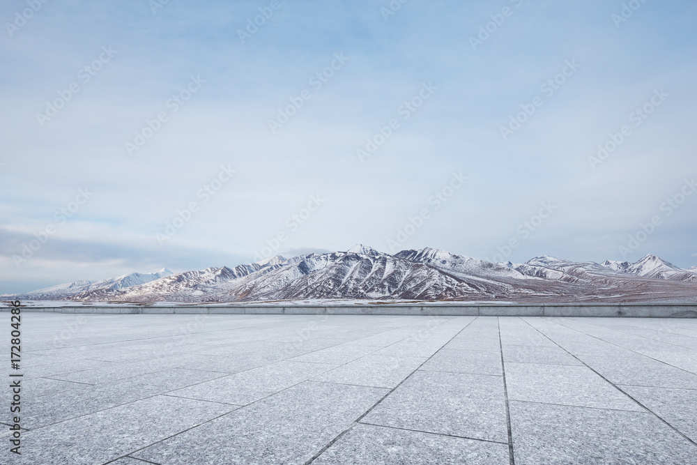 empty marble floor with beautiful snow mountains