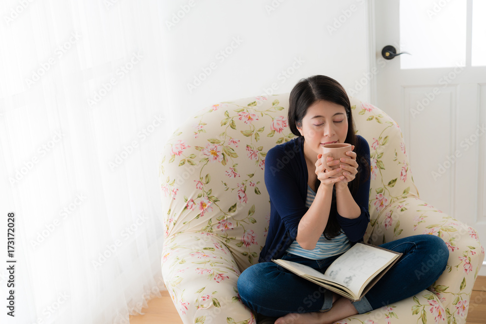 beautiful female model holding hot coffee cup