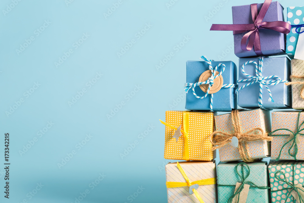 Collection of Christmas present boxes on a light blue background