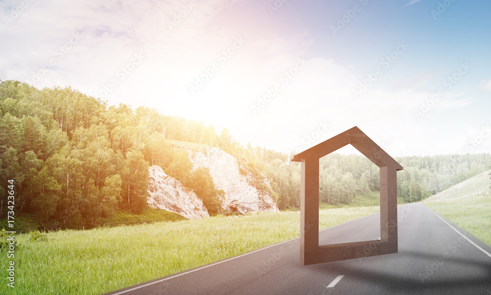 Conceptual background image of concrete home sign on asphalt road