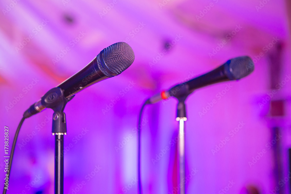 Two microphones on racks. Microphone on stage. Microphone close-up. A pub. Bar. A restaurant. Classi