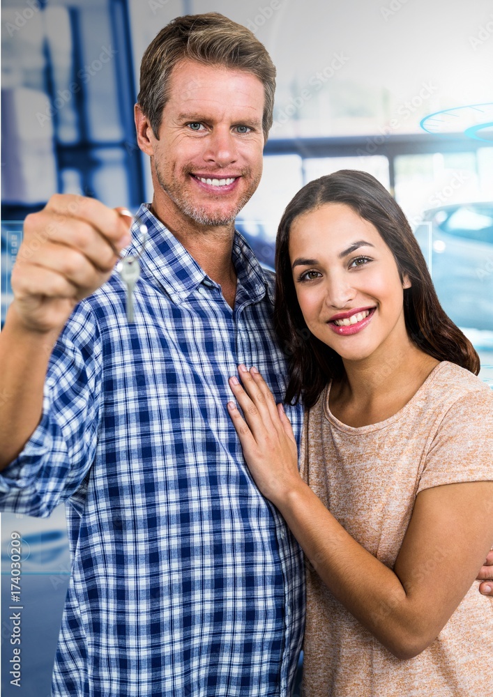 Couple  Holding key in front of cars