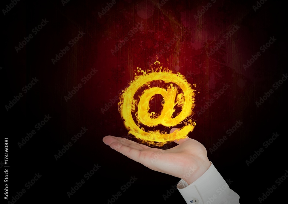 hand with �@ fire icon over. Black and red background