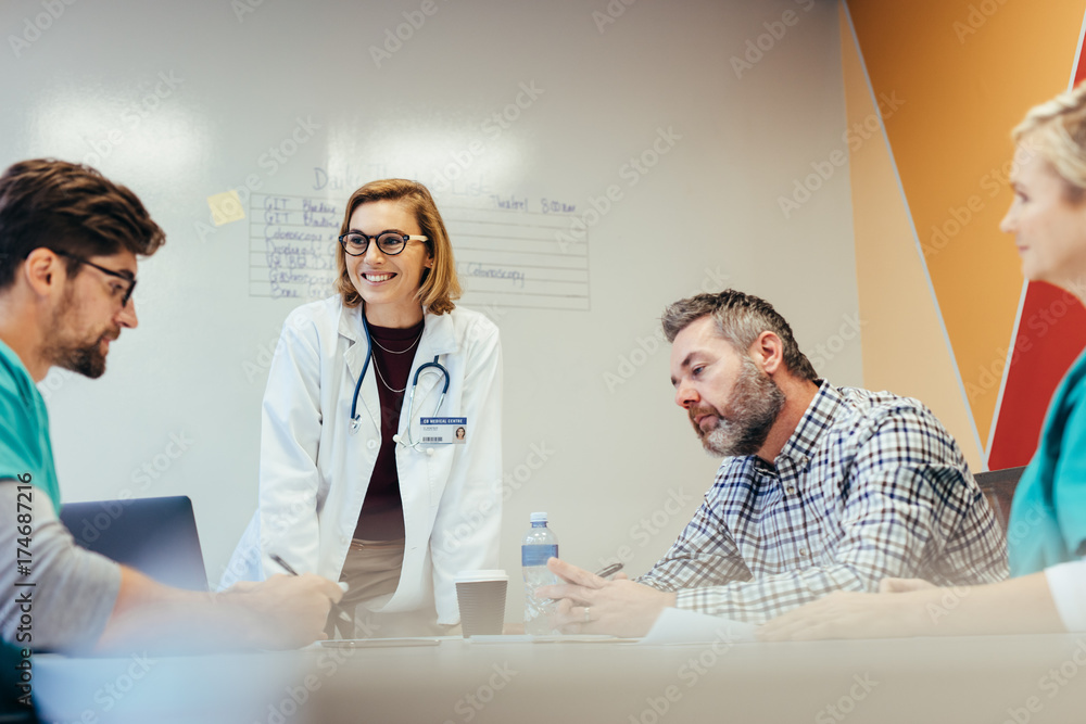 Hospital staff meeting in conference room