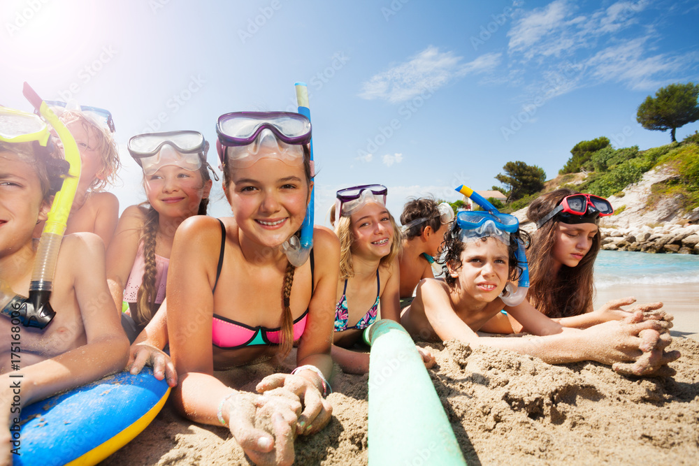 Many friends together have fun on the beach