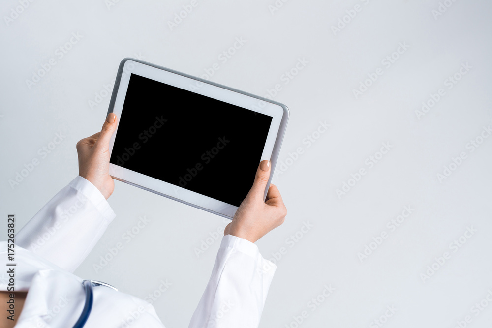 Close of female doctor hands working with tablet pc computer