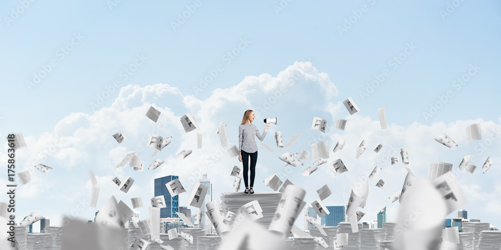 Woman keeping megaphone in hand.