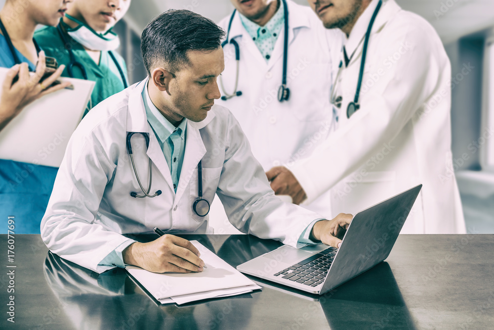 Doctor team meeting with laptop computer.