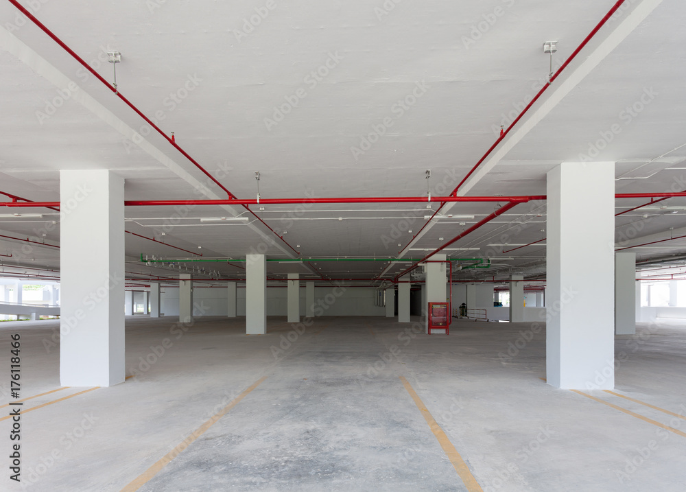 Empty parking garage underground interior in apartment or business building office.