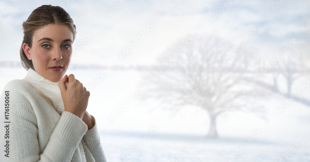 Woman in white warm jumper with bright snow landscape and bare