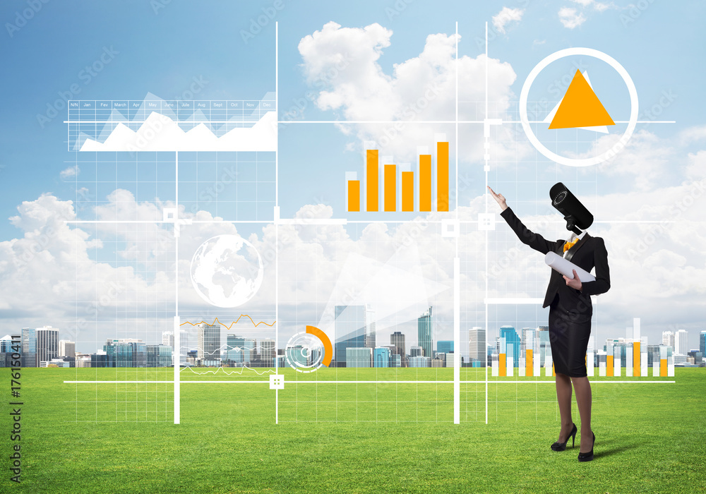 Camera headed woman standing on green grass against modern cityscape