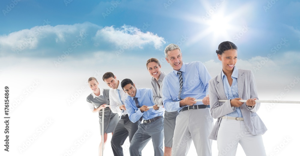 Business people pulling rope in sky