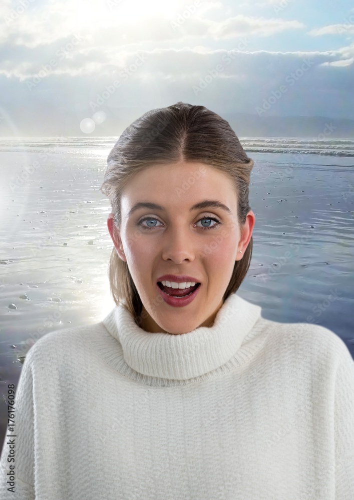 Woman in warm jumper surprised on beach landscape