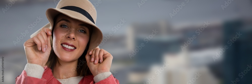 Woman wearing hat in dark city