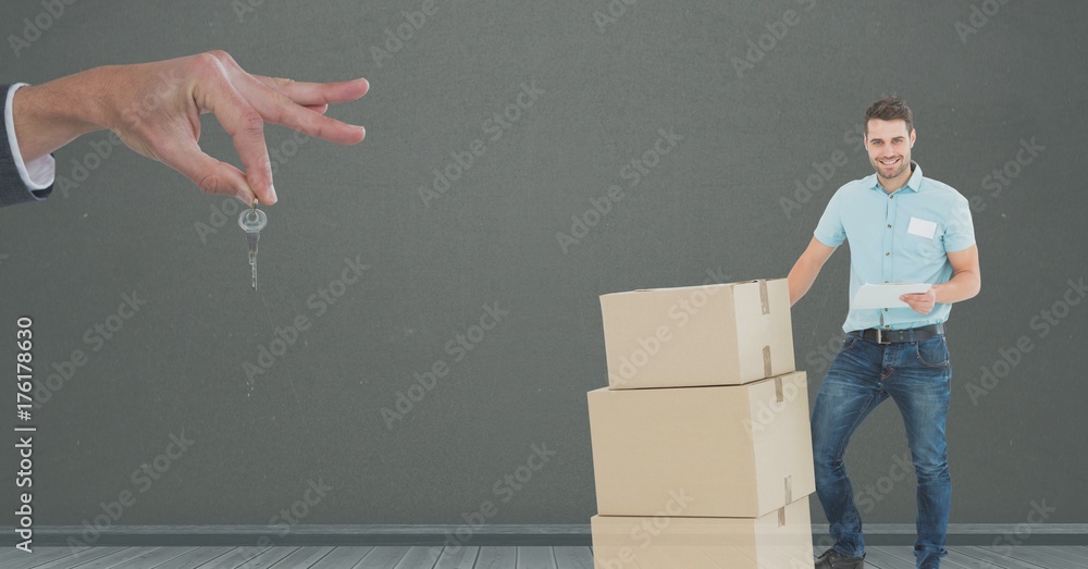 people moving boxes into new home with key