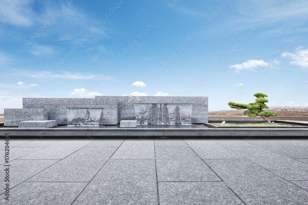 empty marble floor with decorative waterfall