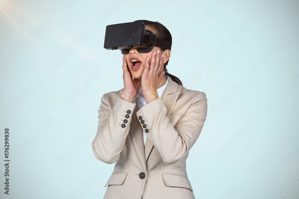 Composite image of surprised businesswoman wearing virtual video