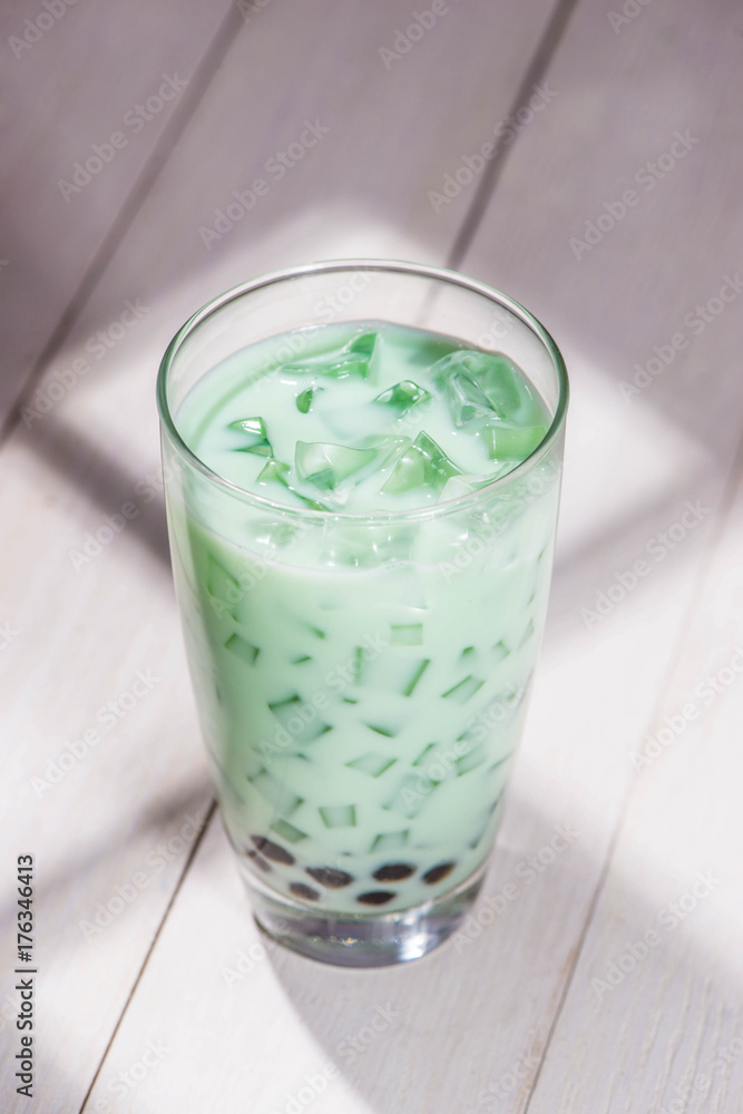 Boba / Bubble tea. Homemade Milk Tea with Pearls on wooden table.