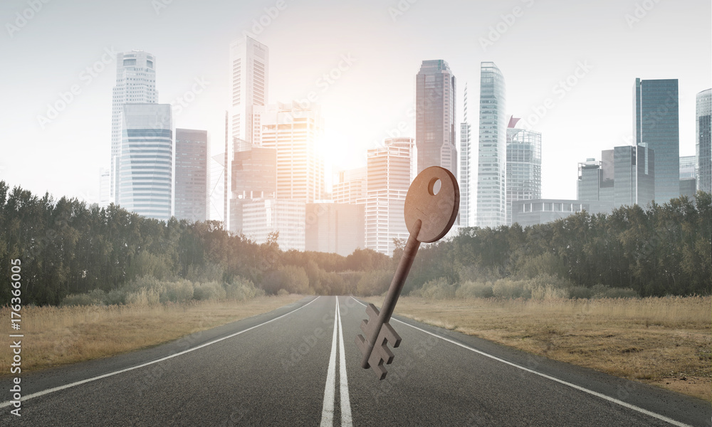 Conceptual background image of concrete key sign on asphalt road