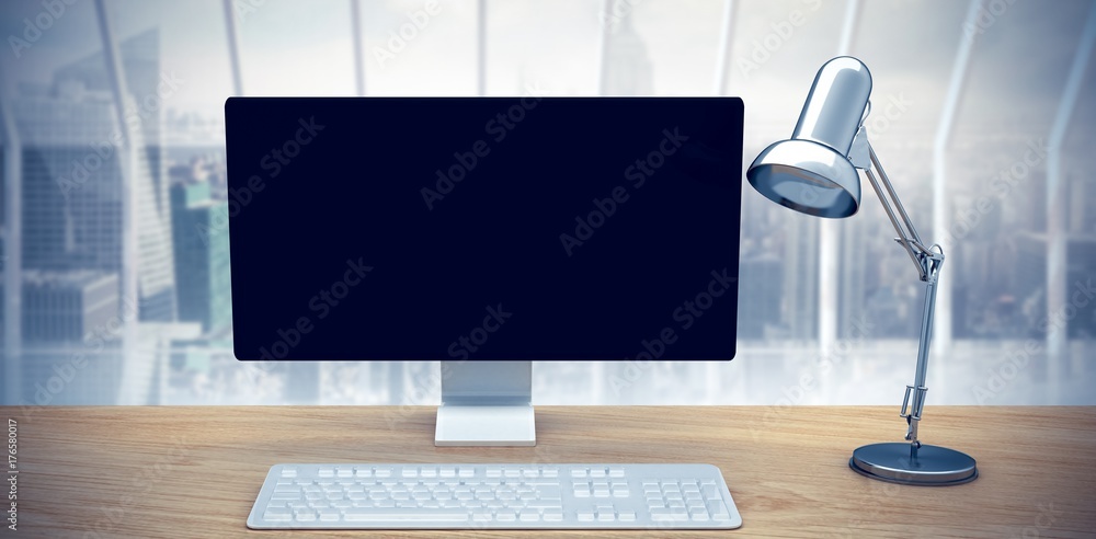 Composite image of computer on a desk