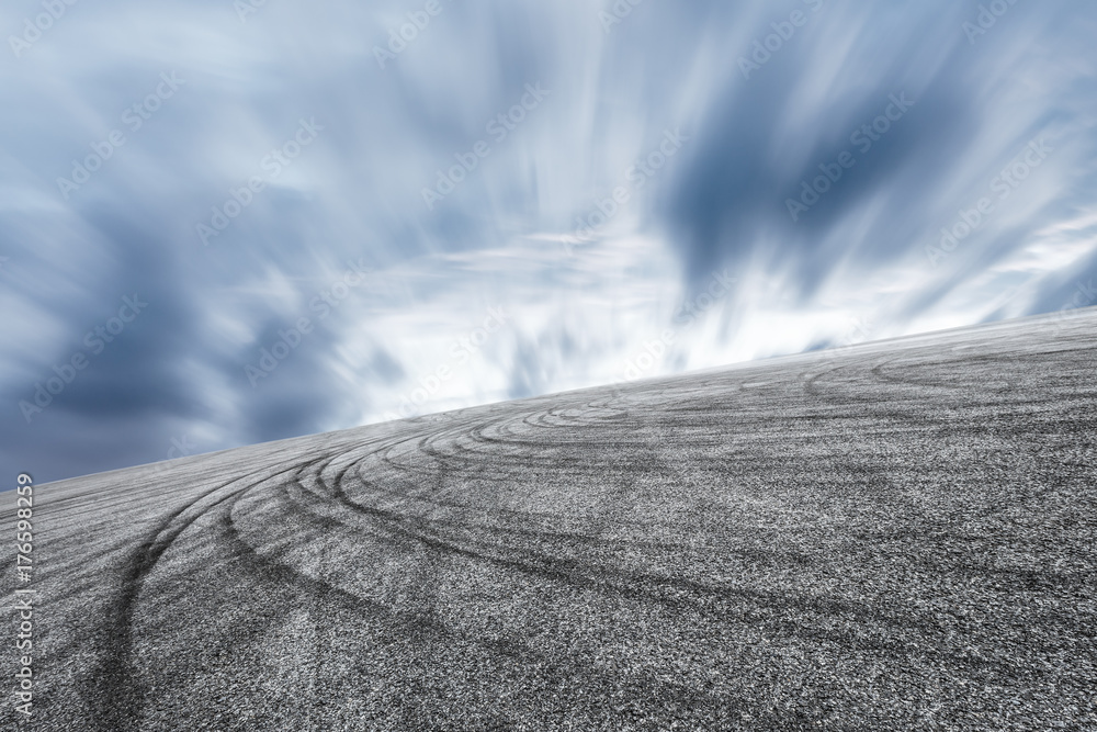 Asphalt road circuit and sky sunset with car tire brake