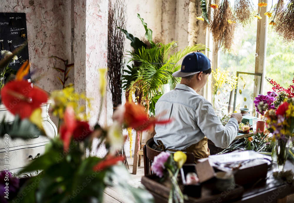 Florist making a flower arrangement in a flower shop