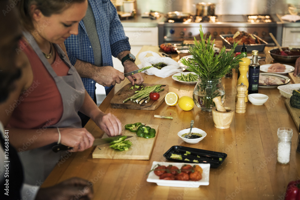 Group of friends are cooking in the kitchen