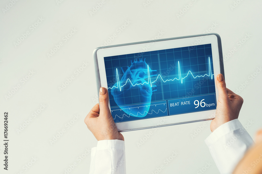 Close of female doctor hands working with tablet pc computer