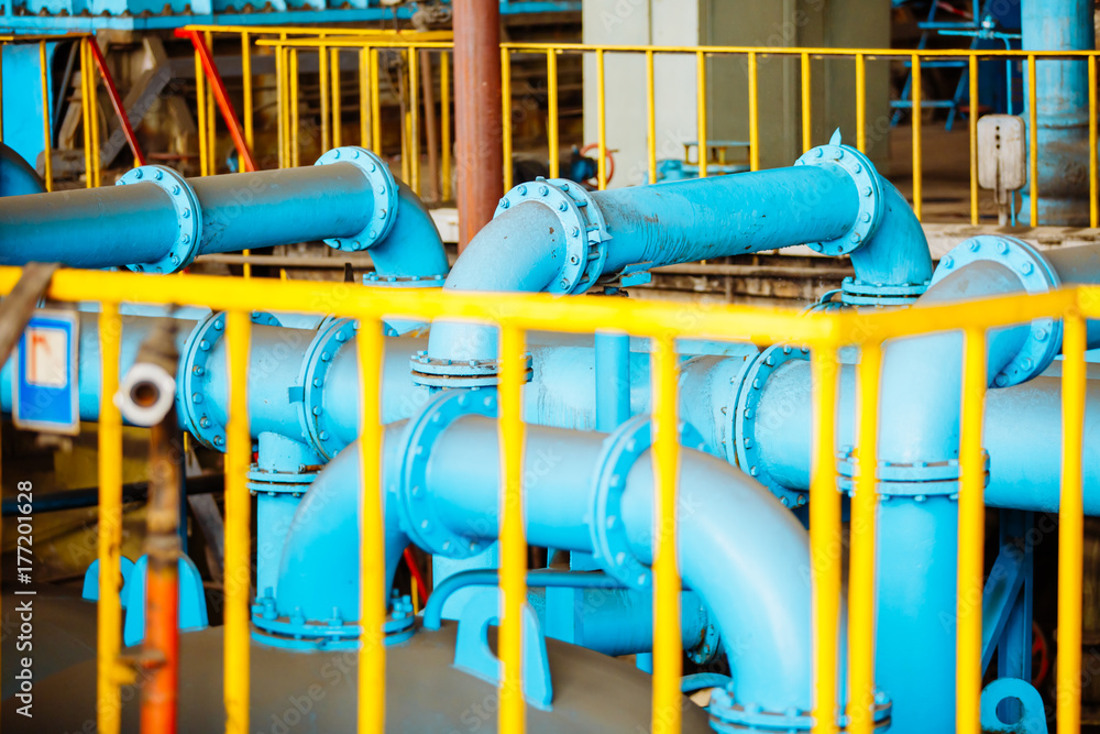 Pipes and valves. Oil or gas pipeline valves. Modern plant with pipeline valves. Power station.