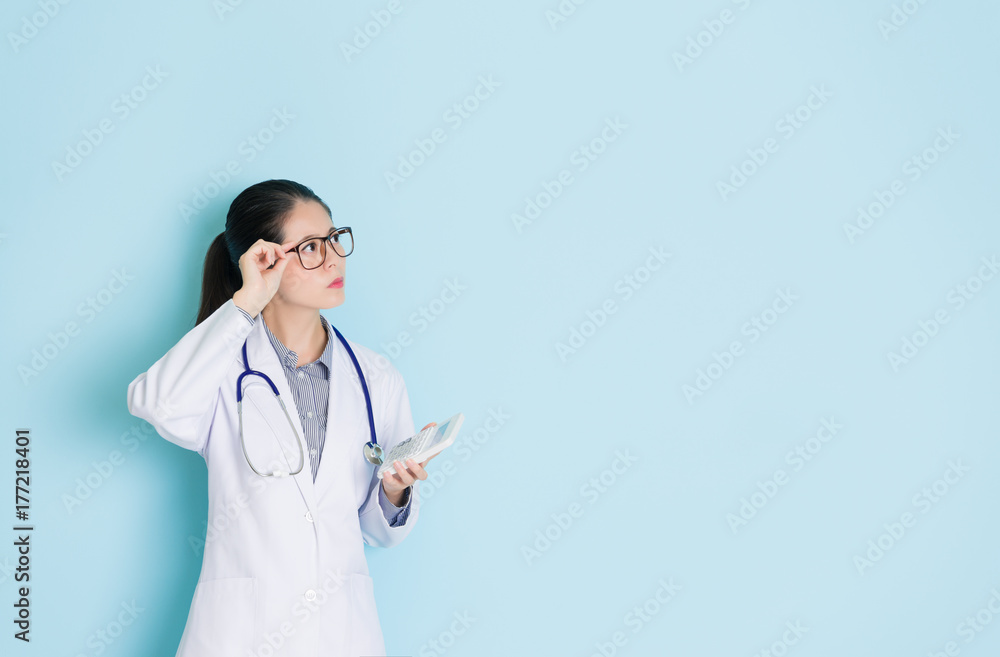 young beautiful doctor woman touching glasses