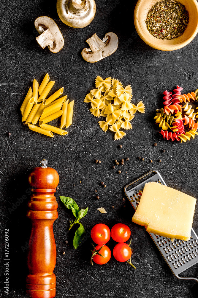 ingredients for cooking paste on dark background top view