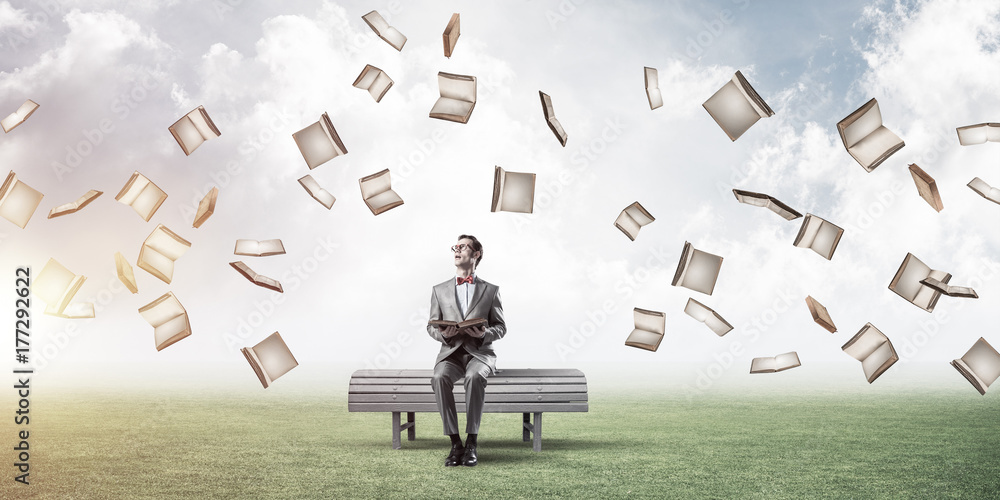 Young businessman or student studying the science and books fly 