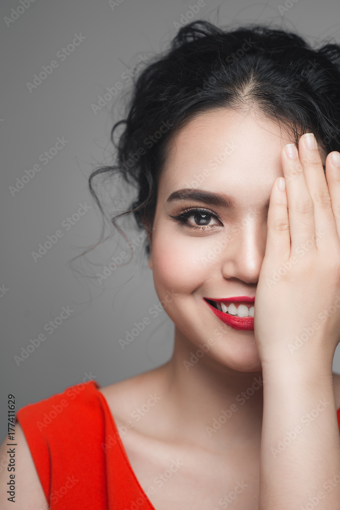 Fashion portrait of asian woman with elegant hairstyle. Perfect makeup.