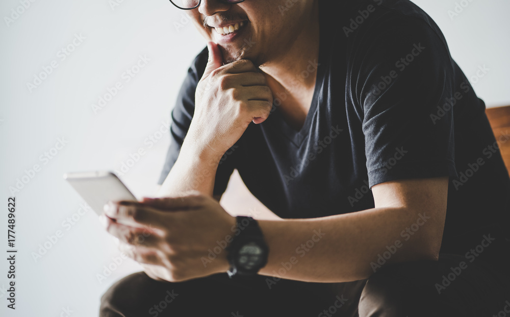 Closeup of businessman using smartphone .