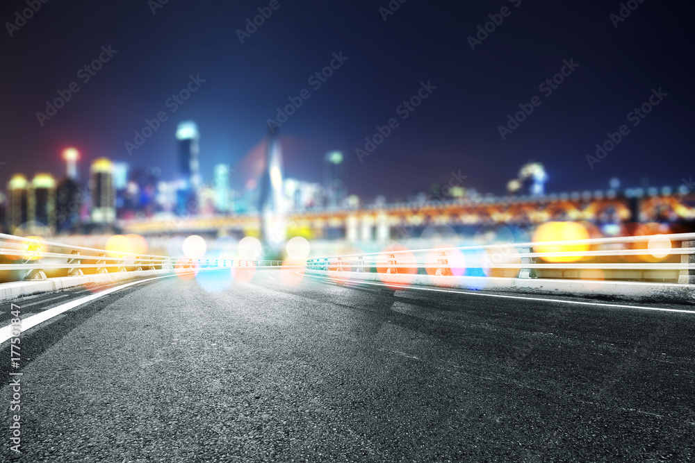 empty asphalt road with modern bridge and buildings