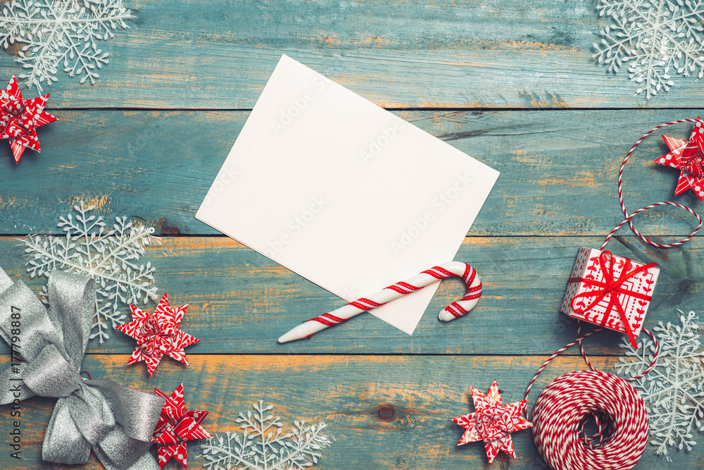 Christmas background with decorations on wooden background. Top view with copy space