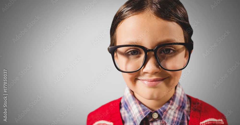 Boy against grey background with huge glasses