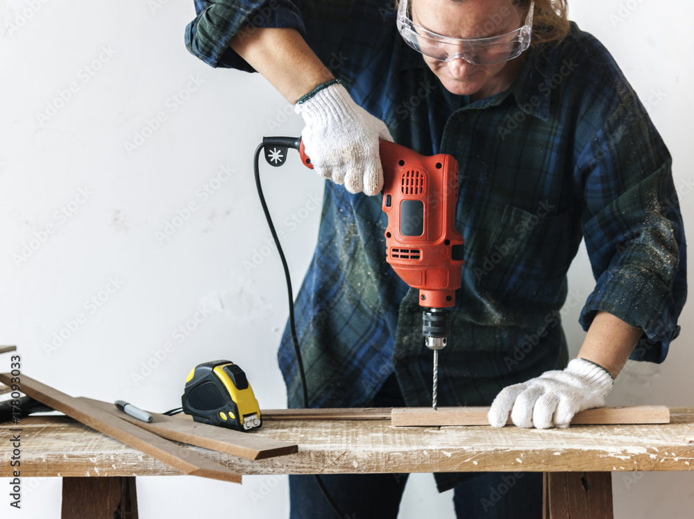 Constractor handyman working and using screwdriver