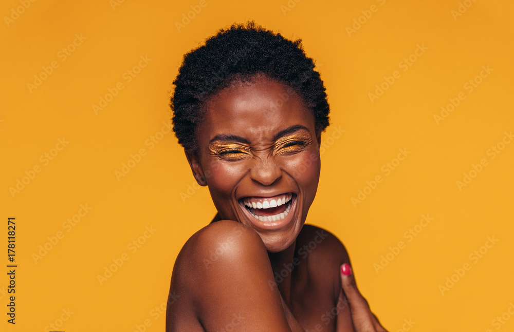 Cheerful woman with vivid eye makeup